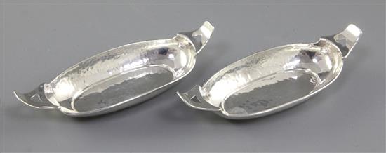 A pair of Edwardian Arts & crafts silver oval navette shaped dishes, by Liberty & Co, Length 139mm, weight 2.8oz/90grms